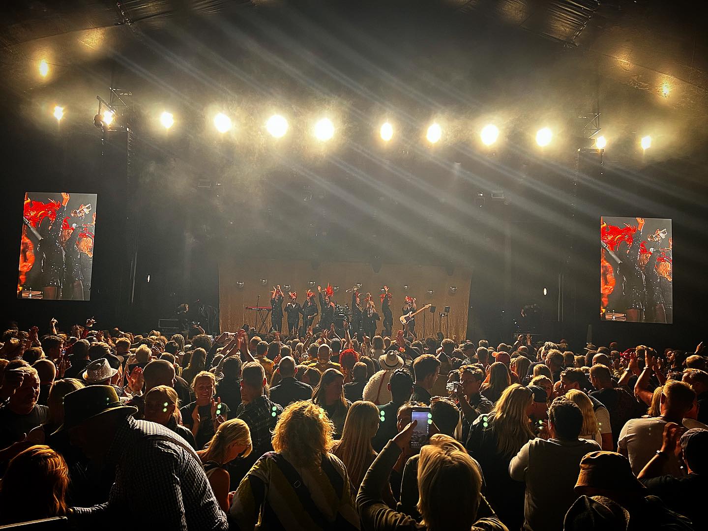 Packed big top tent, the band lit on a distant stage with the show mirrored on two large screens